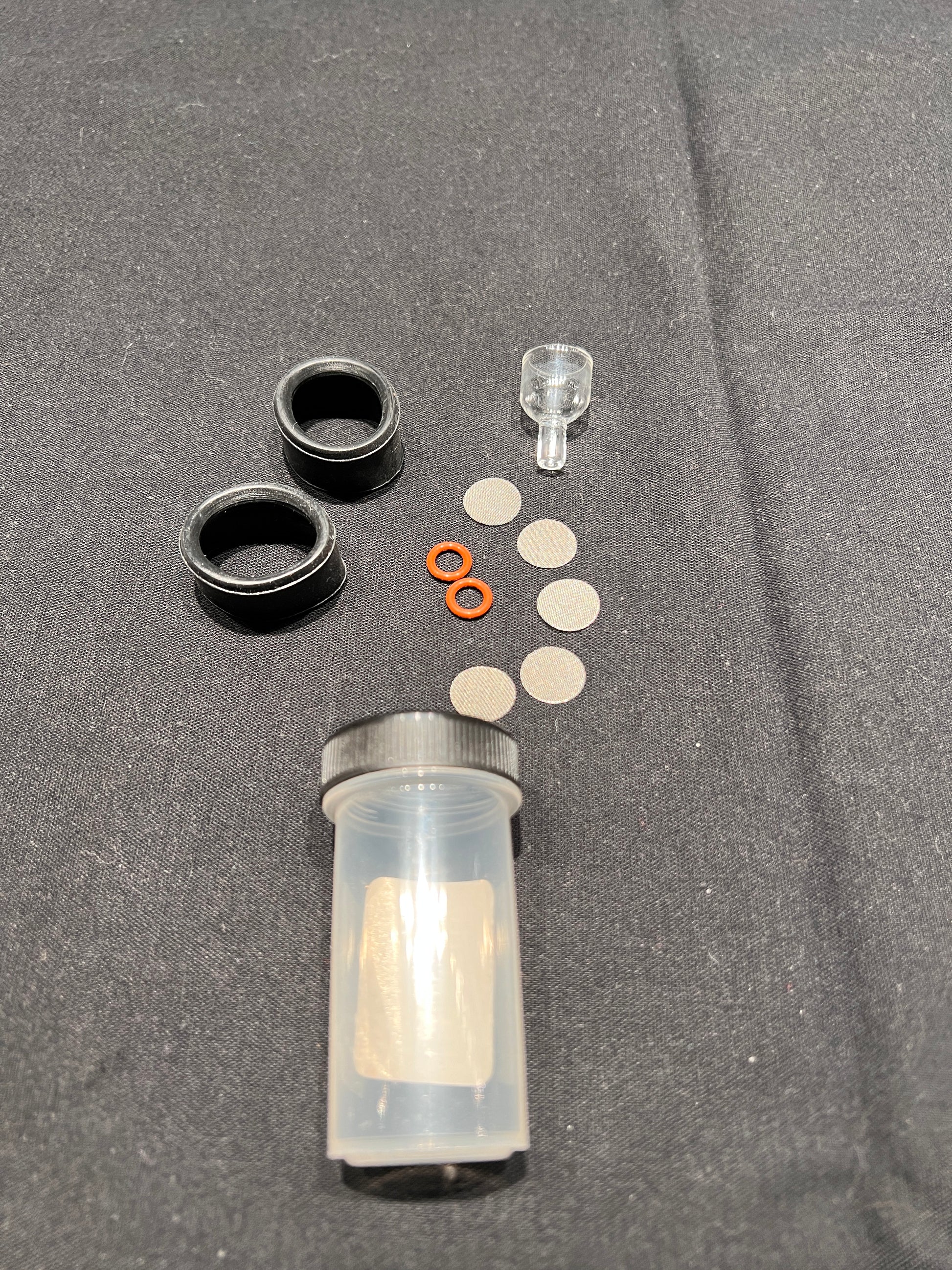 Full Contents of M420 rebuild kit. Includes replacement bowl, five stainless steel screens, two small O-rings and two silicone end covers